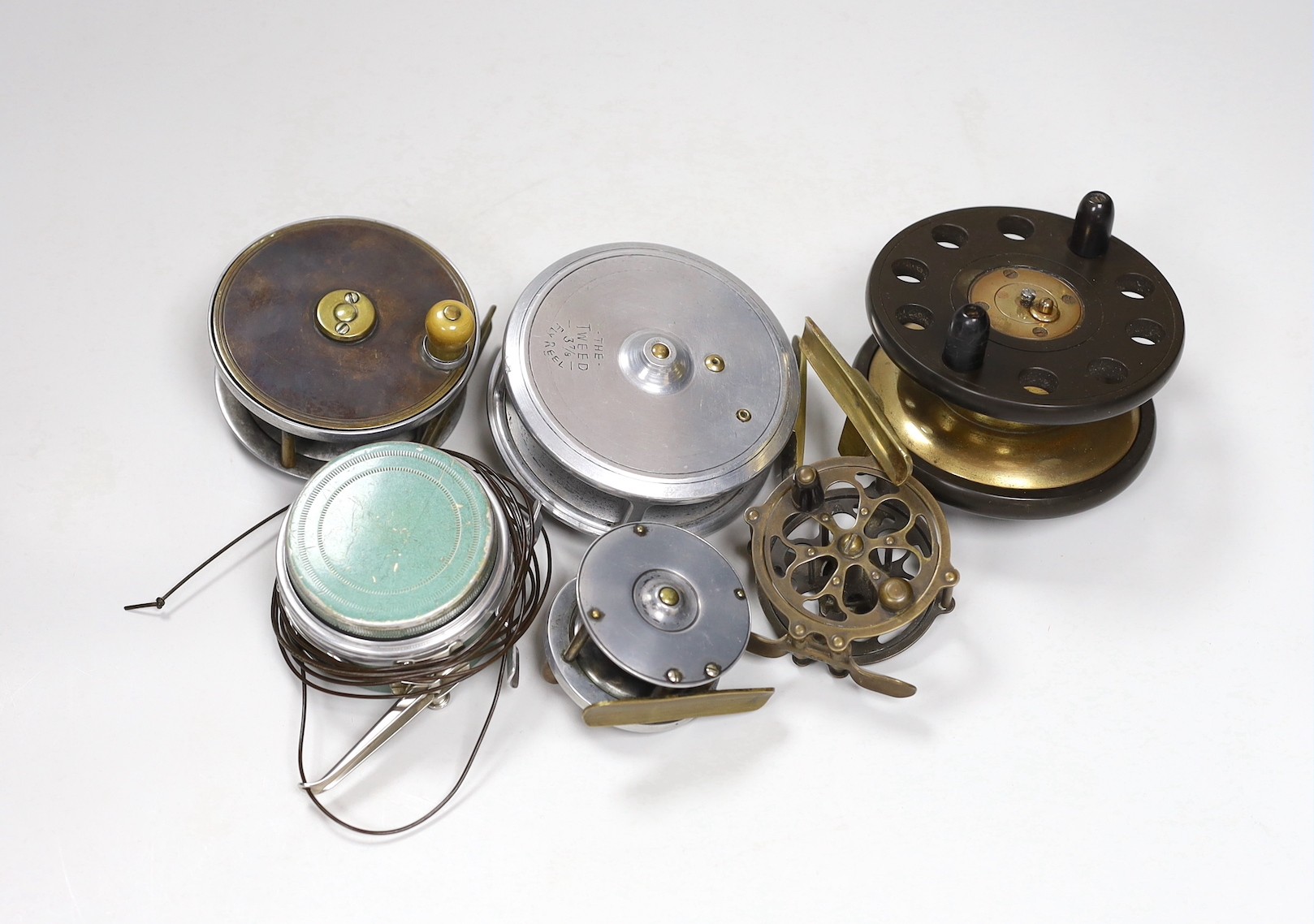 Six fishing reels including a ‘The Tweed 3 7/8 Fly Reel’ and a ‘Martin automatic Mohawk fishing reel’